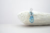 Aquamarine blue colored teardrop crystal earrings