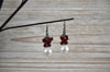Elegant white pearl earrings with red accents