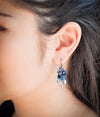 Iridescent deep green teardrop shaped crystal pearl earrings