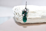 Emerald green crystal teardrop earrings with silver pearls